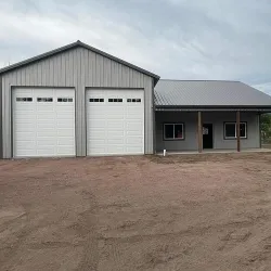 A bardominium with two large bay doors